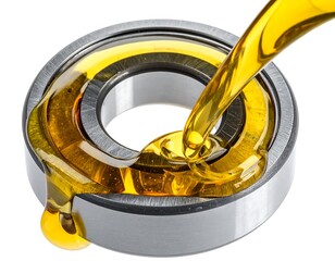 Gleaming yellow fluid flows onto a shiny metal bearing, dripping down its side, on a crisp white background