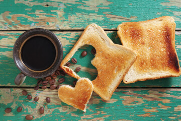 Coffee and toast with a heart-shaped cutout