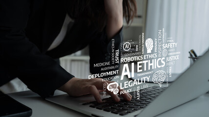 Close-up of human hands on a laptop keyboard with ethereal words related to AI ethics, technology governance, and policy, emphasizing modern challenges in the digital age. Tessel
