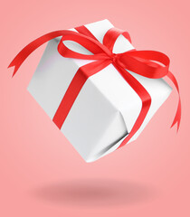 Gift box falling on pink background. Present