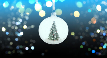 Christmas ball with fir tree inside and bokeh lights on greeting card