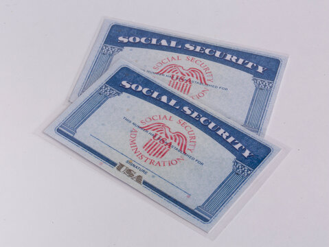 Moscow, Russia, 11.28.2025. An American social security document against the backdrop of the US flag.