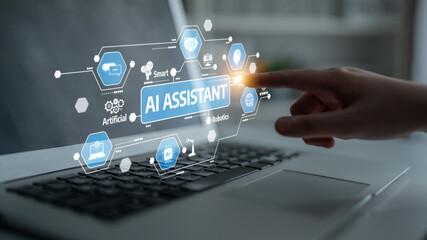 A hand interacts with a laptop screen displaying an AI assistant interface, highlighting modern technology, innovation, and robotics concepts in a sleek workspace setting. Tessel