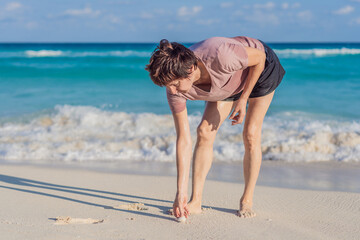Elderly woman spending relaxing time on the beach, enjoying the ocean breeze and warm sunlight. Concept of active aging, mindfulness, serenity, healthy lifestyle, and peaceful coastal living