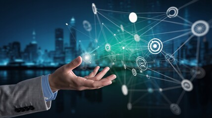 Businessman holding digital network connecting smart city solutions