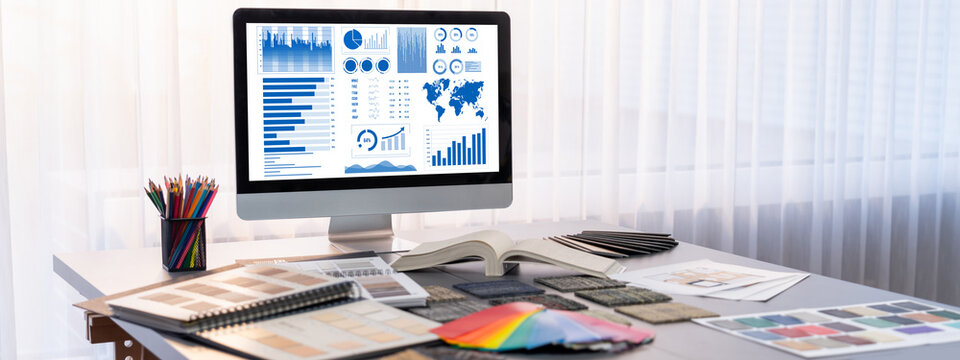 Interior designer workspace table and architecture software on laptop screen with mood board materials and colorful swatch color for color selection. Modern interior design office. Insight - Powered by Adobe