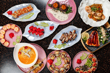 A variety of sushi sets displayed together in one image, showcasing assorted rolls, nigiri, and garnishes in a colorful and appetizing arrangement.