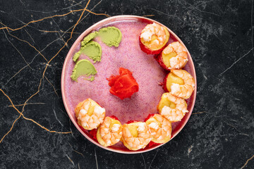 Fresh sushi featuring salmon, with perfectly rolled rice and garnishes, highlighting the vibrant orange color, textures, and appetizing presentation of the Japanese dish.