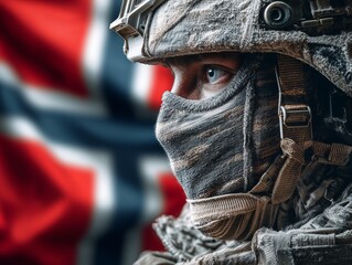 Obraz premium A soldier in camouflage gear and mask with the Norwegian flag blurred in the background. Conveys discipline and national identity. 