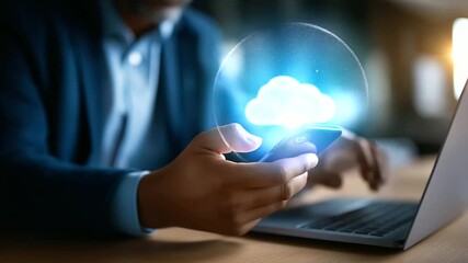Faceless businessman using smartphone and laptop with cloud computing technology interface online data management system secure file transfer platform digital business - Powered by Adobe