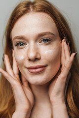 Fototapeta premium redhead caucasian model showcasing freckles and natural glow