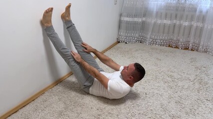 Set of morning routine clips showing a forty five year old man waking up stretching shaving brushing teeth lifting dumbbells cooking in kitchen and beginning. fresh energetic day.