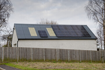 Solar panels installed on home roofs at new housing development