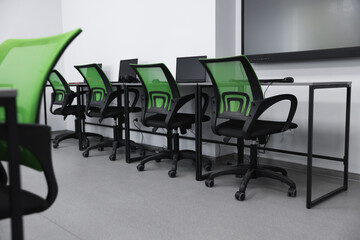 Computer science class with laptops at school