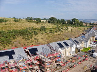 Solar panels installed on home roofs at new housing development