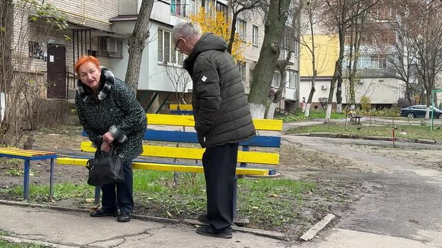 Happy Caucasian family retired married couple 65s old mature woman man going walking park autumn nature carefree wife husband love romantic relationship intelligent female male. stroll together.