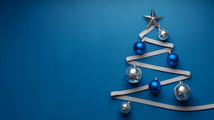 Minimalist Ribbon Christmas Tree with Blue and Silver Ornaments on Blue Background