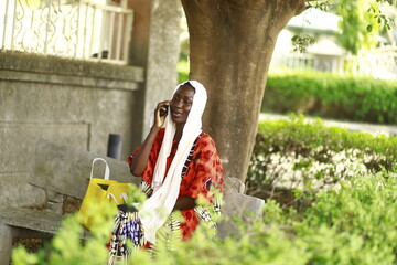 young african lady using smartphone
