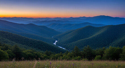 Scenic mountain landscape at twilight with a winding river and forested hills