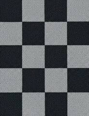 Fototapeta premium A close-up view of a textured fabric featuring a black and gray checkerboard pattern. The image showcases the intricate weave and contrasting colors of the material.