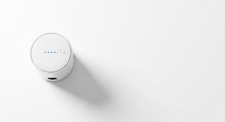 Compact communication device showing four signal strength indicators, placed on seamless white backdrop.