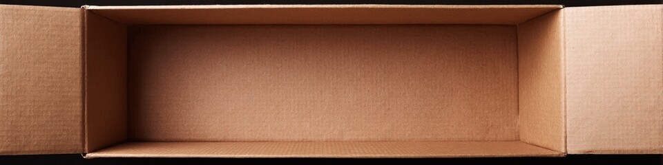 Fototapeta premium Open empty cardboard box with flaps on black background
