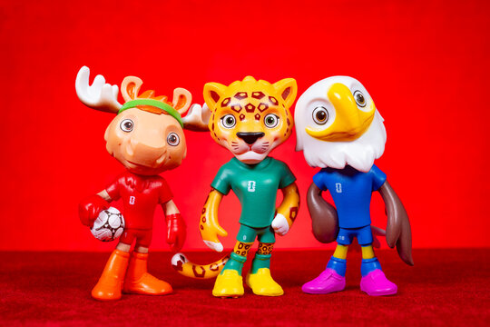 ZHONGSHAN China-November 5 2025: official mascots for the 2026 FIFA World Cup on red at horizontal composition.