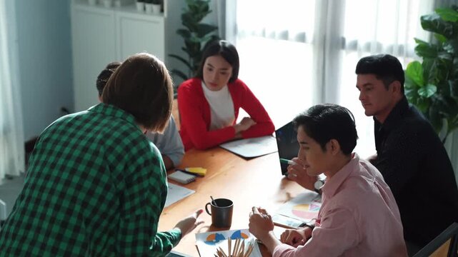 Executive manager explain marketing idea to investor while skilled diverse business team clapping hand to celebrate successful project. Skilled group applause businesswoman presentation. Convocation.