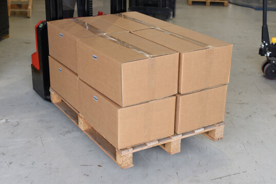 Stacked cardboard boxes on pallet in warehouse