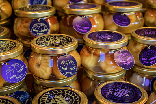 Jars of Baba au Rhum or Rum Baba cakes at the Christmas market in Colmar, France