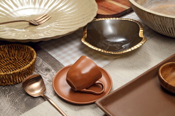 Close-up of sophisticated table settings with plates, cutlery, bowls, and glasses for beautiful events and dinners.