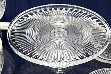 Close-up of sophisticated table settings with plates, cutlery, bowls, and glasses for beautiful events and dinners.