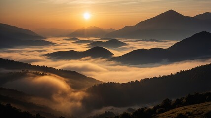 Golden sunrise over misty mountain peaks, a serene landscape with fog-filled valleys.