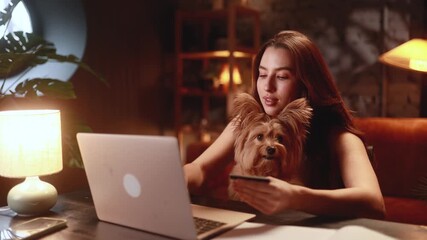 casual home videochat with pet and friend, comfortable remote interaction between owner and canine buddy, relaxed digital conversation showcasing woman bonding with her pet during leisure time