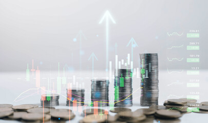 Stacked coins with digital financial charts and rising arrows illustrate investment growth, market performance, economic trends, and wealth management, representing long-term financial planning.