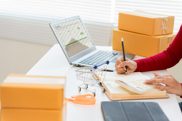 Close up of parcel box on table. Online shop owner, small business owner, entrepreneur, packing boxes, checking website, ordering products.