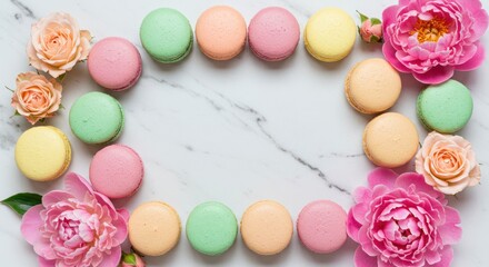 Fototapeta premium Pastel Macarons and Floral Frame on Marble: Sweet, Elegant Composition