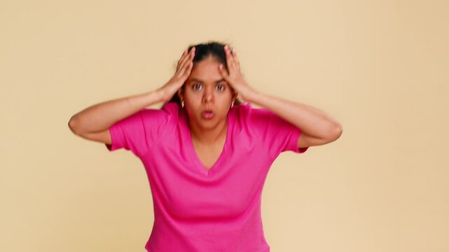 Indian woman dramatically waves hands, mouth wide open, vividly showing strong excitement or panic. Arabian girl expressively conveys emotional shock, surprise, urgency or intense reaction moment.