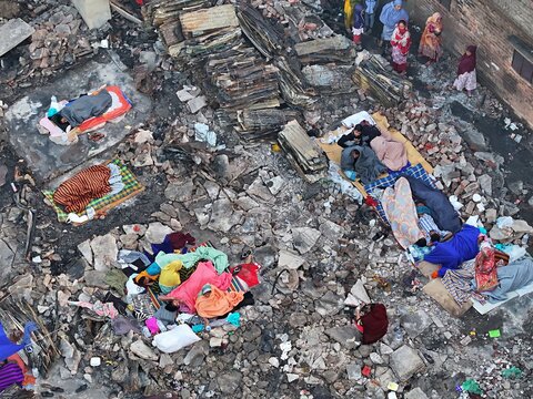 Dhaka, Bangladesh - 28 November 2025: Aerial view of the Korail slum's raw reality, where life unfolds amidst rubble and vibrant colors, a mosaic of resilience against a backdrop of hardship.