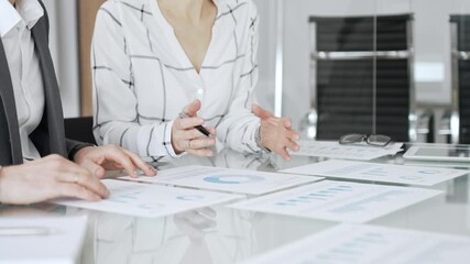 Business professionals analyzing financial data, discussing market trends, and planning corporate strategy in an office meeting. Business-people concept - Powered by Adobe