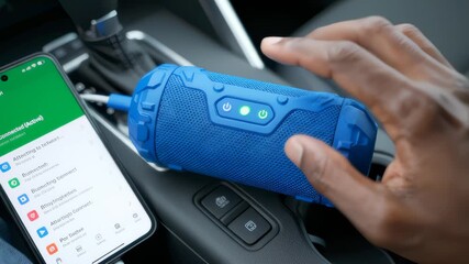 Man Turns on Bluetooth Speaker in Car Using Phone App, Close Up