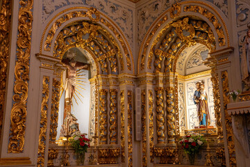 Statue of Jesus Christ and other saints inside the Christian church of S&atilde;o Sebasti&atilde;o da Pedreira in Lisbon