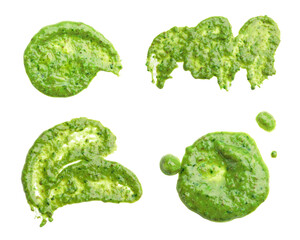 Set of fresh pesto sauce isolated on white, top view