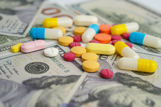 Pills on money dollars, Medicine prescription drugs cost concept, healthcare expenses - Powered by Adobe