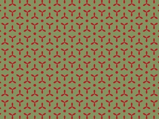 This pattern features red floral shapes and stars on green.