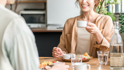 A woman eating a delicious lunch with her female friends and mom friends (girls' get-together)
