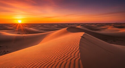 Serene Sunrise Over the Majestic Desert Dunes with Vibrant Orange Sky and Golden Light