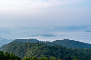 Spectacular summit perspective showcasing the sea of mist with mountain ridges in the foreground at Lan Ya Bupphasawan, Nakhon Si Thammarat Province, Thailand.