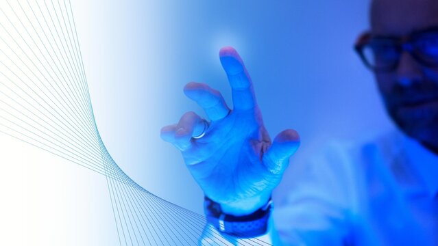 Man touching the futuristic blue screen