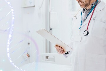 Doctor reading a coronavirus patient medical chart